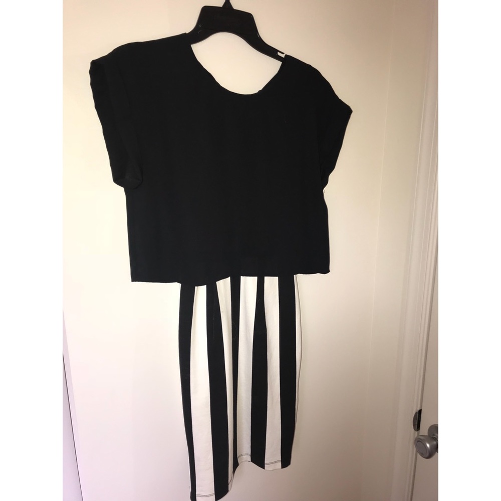 Black top, and striped bottom dress, is connected!